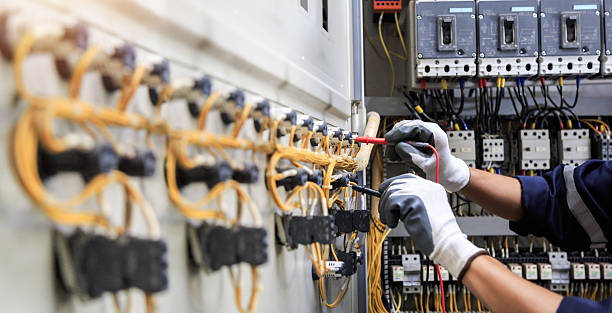 Professional Electrician technician working in Mount Rainier, MD
